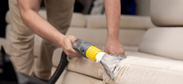 Cleaning a dirty sofa with a sofa washer. Close up of hands holding sofa cleaner. Professional sofa wash. Sofa wash image Cleaning a dirty sofa with a sofa washer. Close up of hands holding sofa cleaner. Professional sofa wash. Sofa wash image